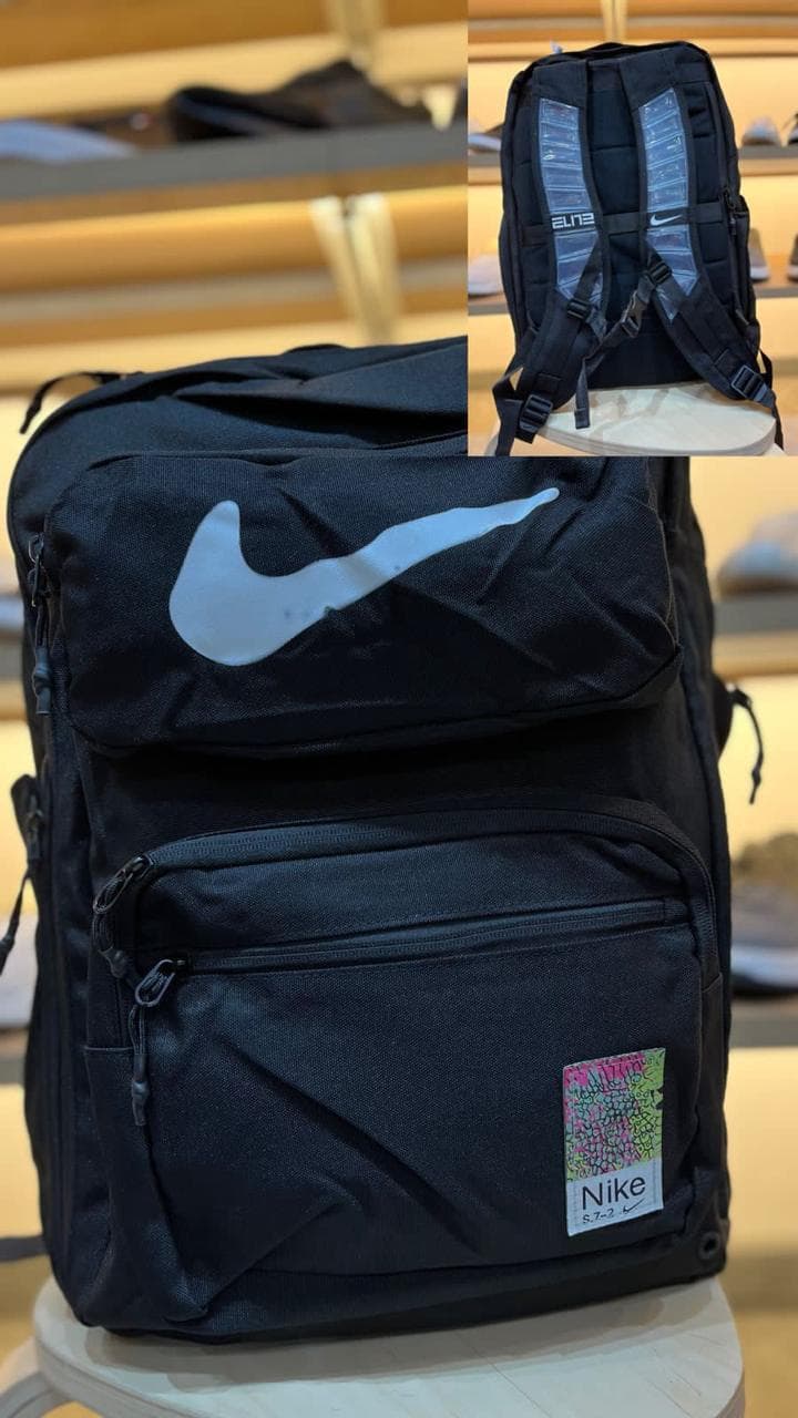 Morral Nike Elite negro con swoosh blanco grande y espaldar Elite acolchado al por mayor Colombia 2026 — desde $68.000 COP mayorista Kikluxe Triple AAA, el morral favorito de estudiantes, gym y streetwear con envíos 24-48h sin mínimo